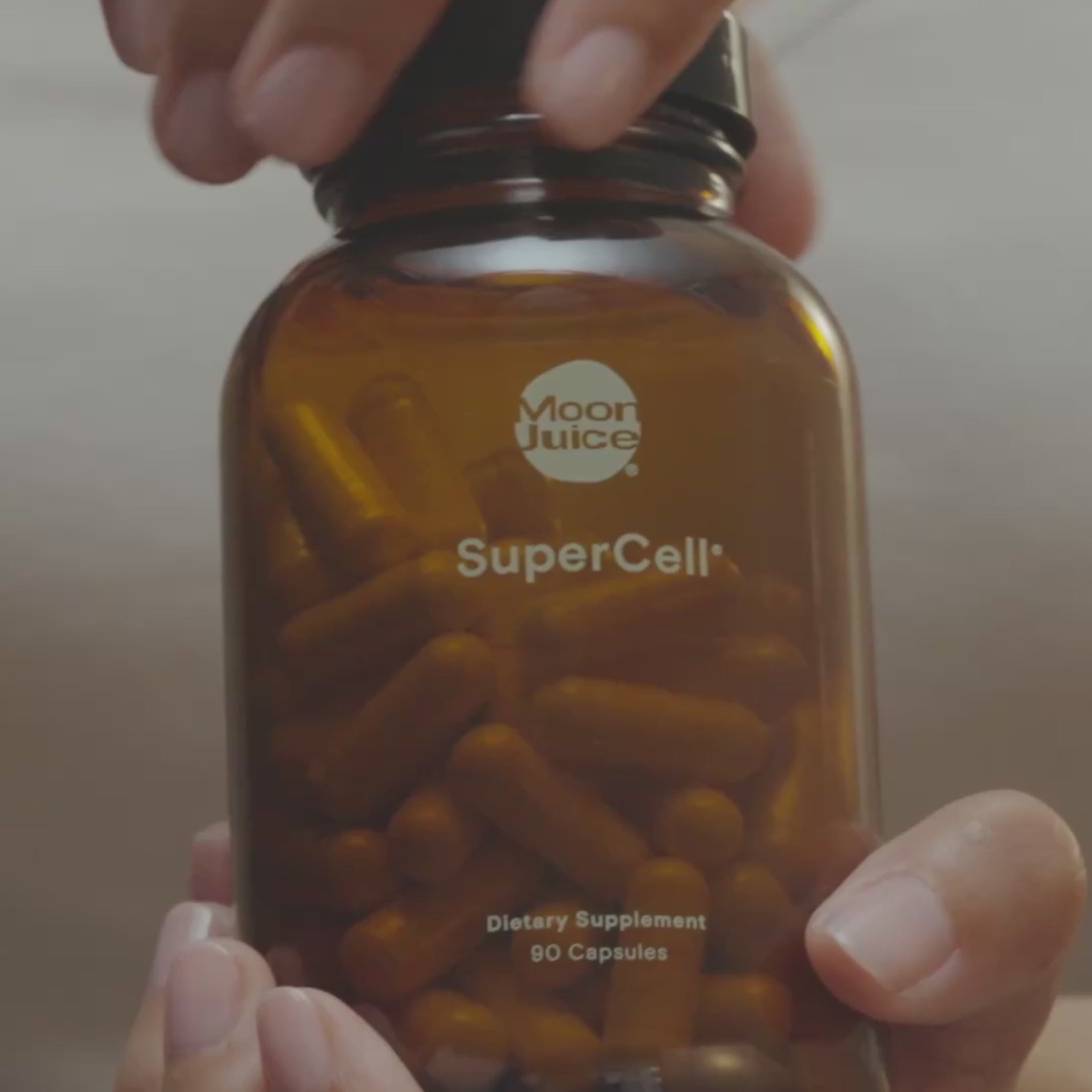 Video of SuperCell jar being opened, capsules being poured into hand, then put into a mouth and swallowed with a glass of water